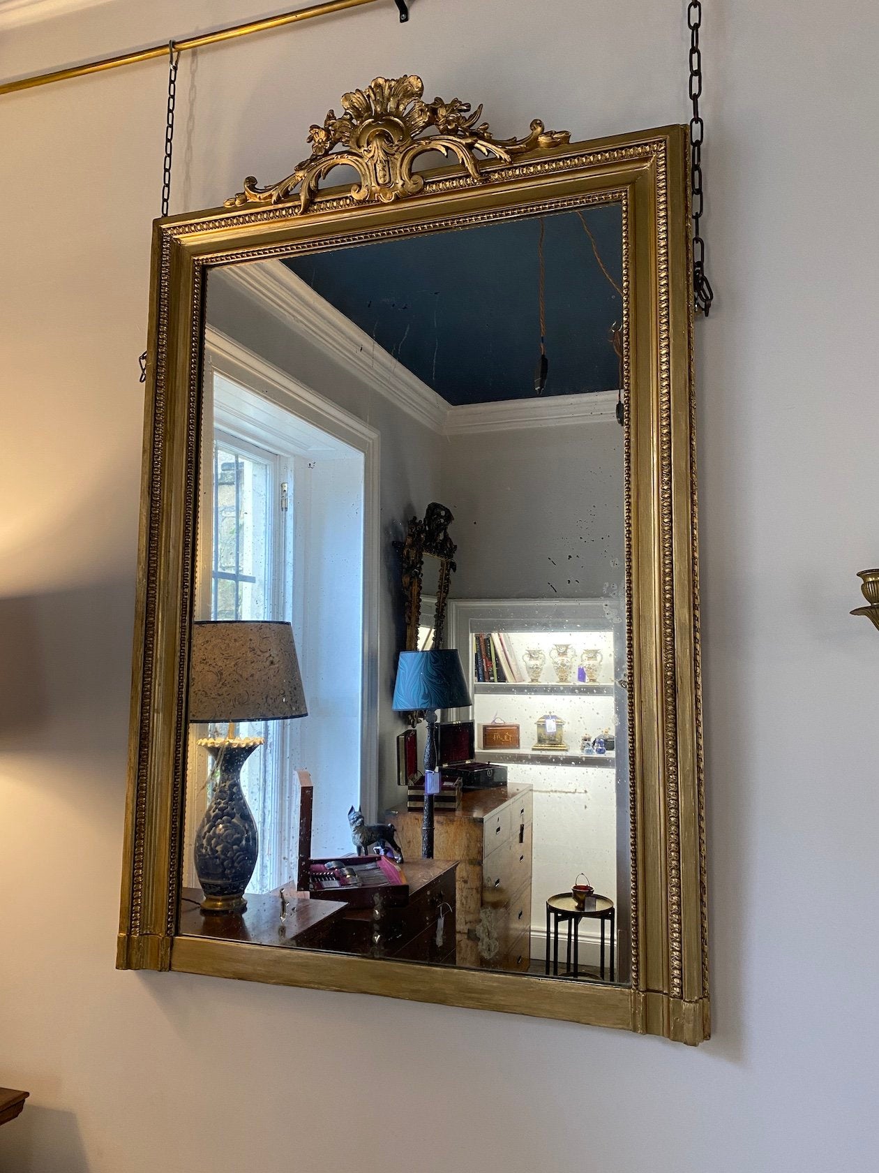 ANTIQUE 19TH CENTURY GILTWOOD OVERMANTLE MIRROR WITH ORNATELY CARVED FLORAL TOP AND ORIGINAL AGED MIRROR