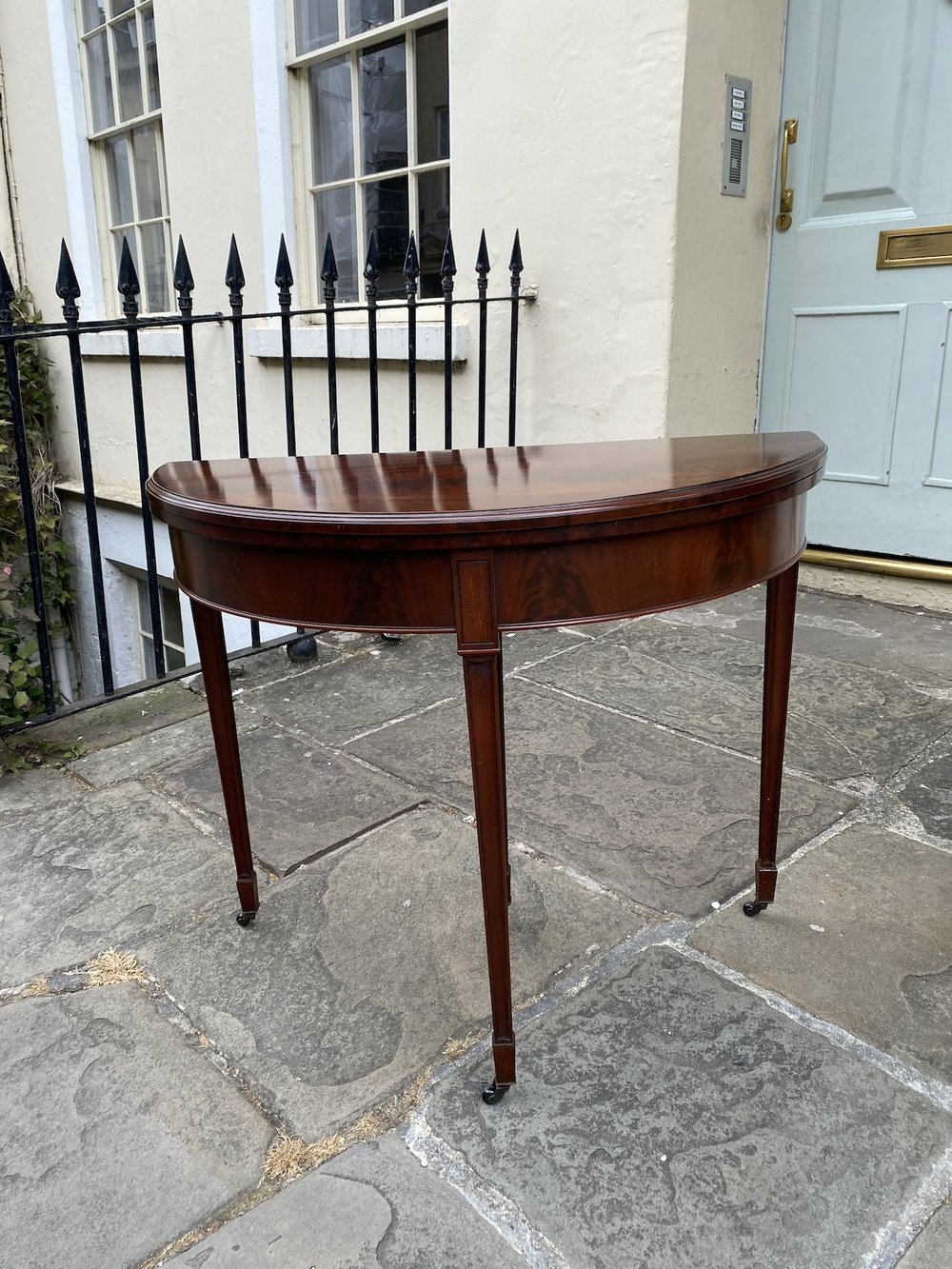 EDWARDIAN MAHOGANY DEMI LUNE CARD TABLE WITH GREEN BAIZE CIRCA 1900