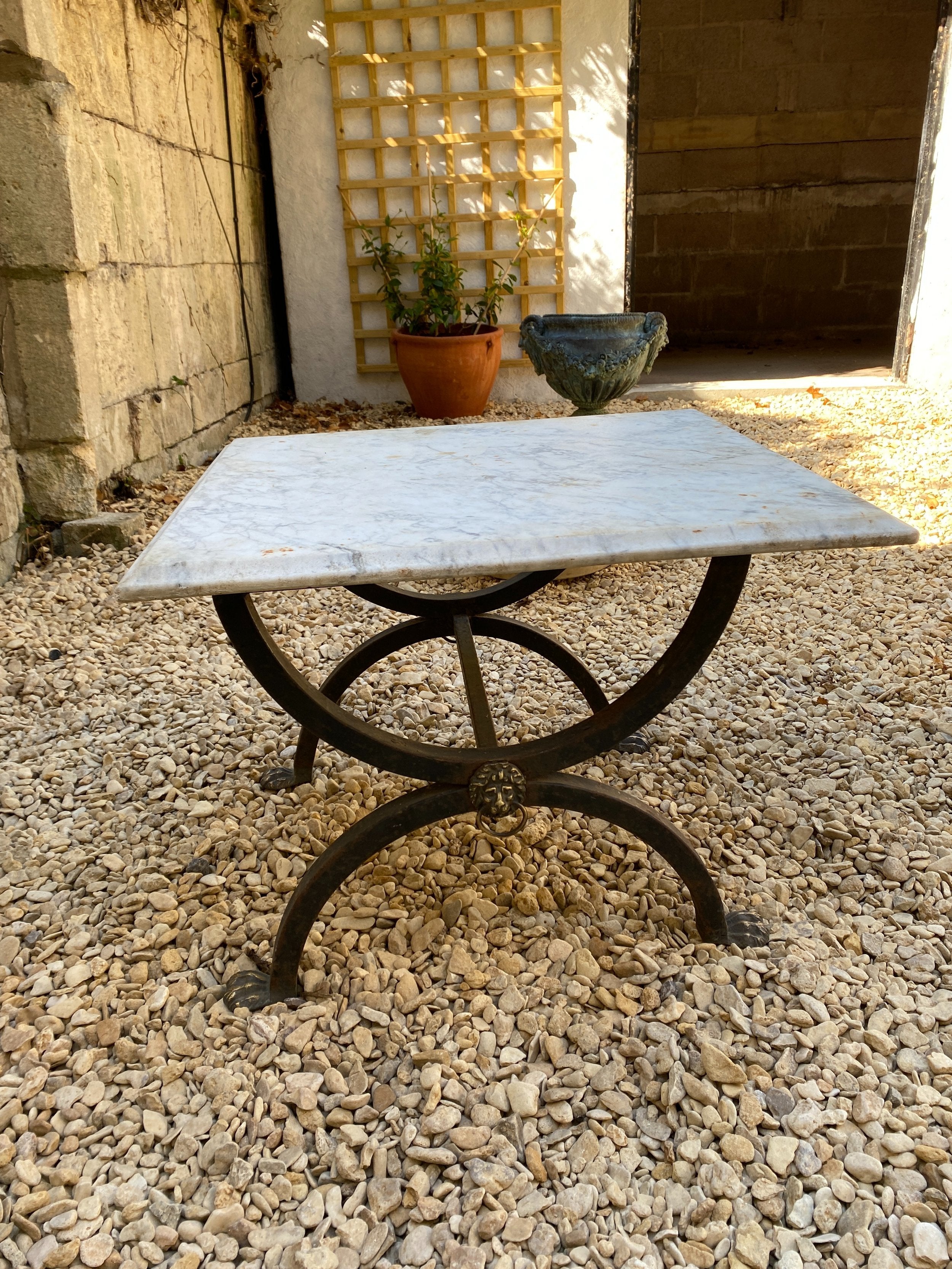 EARLY 20TH CENTURY IRON AND BRASS FRAME MARBLE TOP TABLE