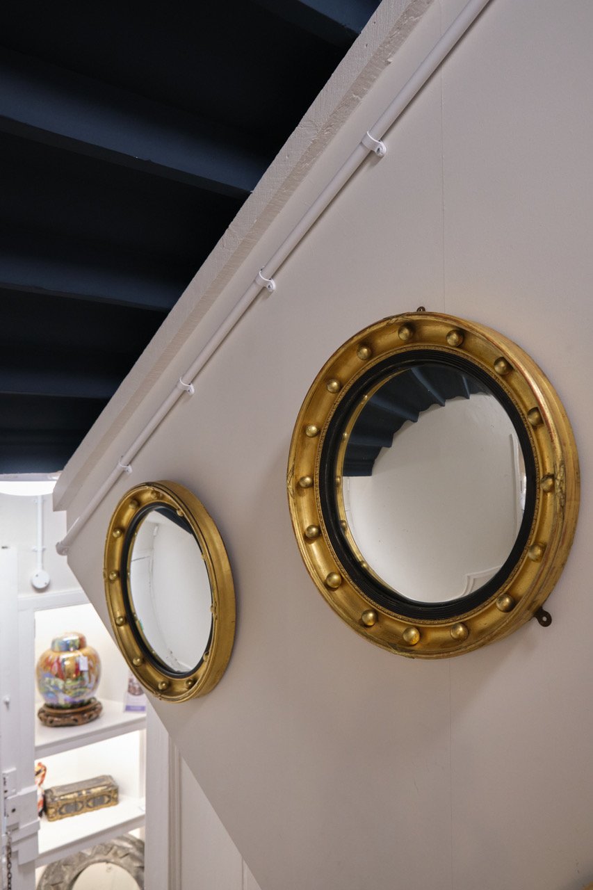 A PAIR OF GILT CONVEX MIRRORS CIRCA 1920