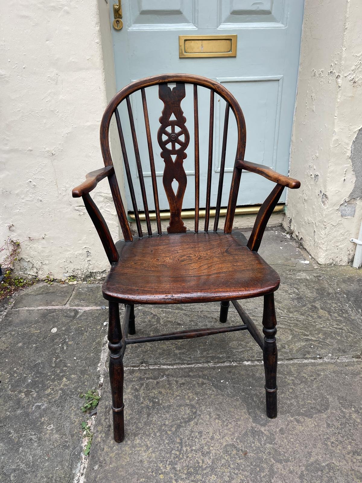 19TH CENTURY ASH, ELM, FRUITWOOD, AND BEECH WINDSOR ARMCHAIR WITH PIERCED WHEELBACK SPLAT CIRCA 1840