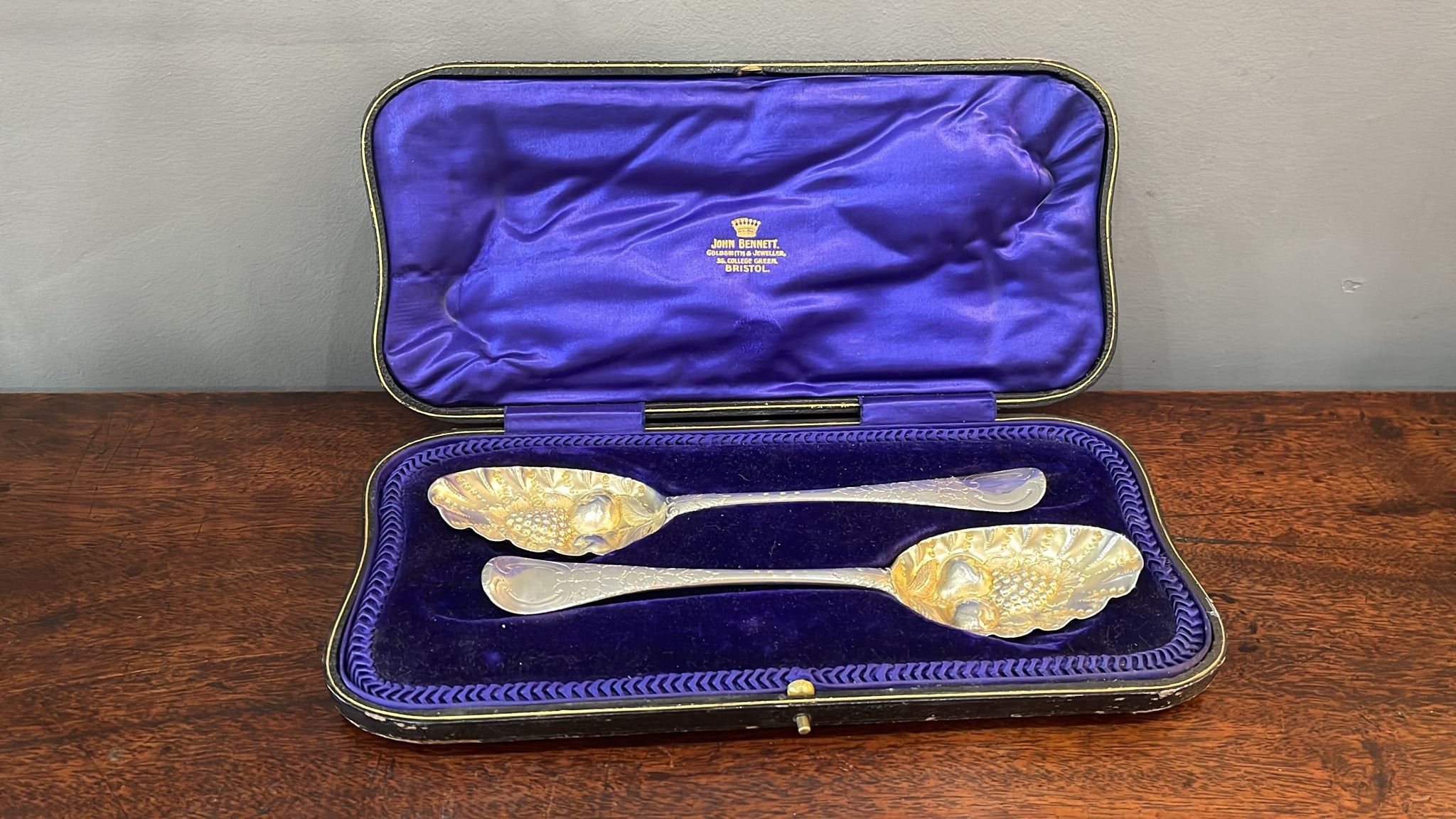 Boxed set of early Georgian silver berry spoons with gilt bowl retailed by John Bennett of Bristol made in London (BN725)