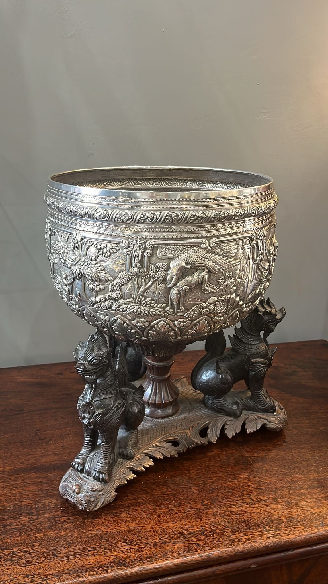 Burmese heavily embossed silver bowl on a teak stand (BN4803)